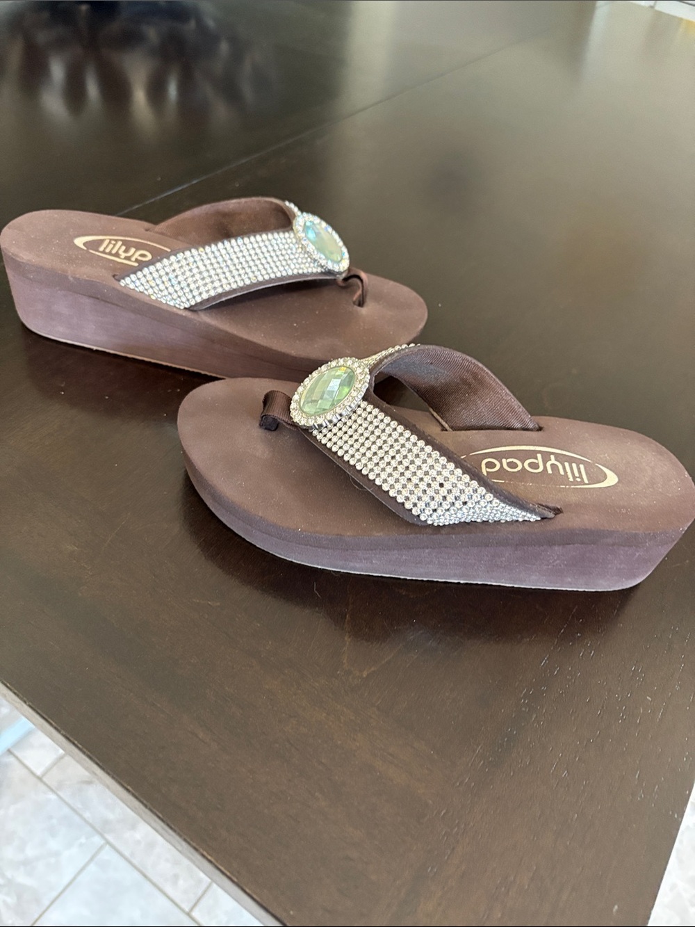 Embellished Brown Wedge Sandals with Green Gem Accent